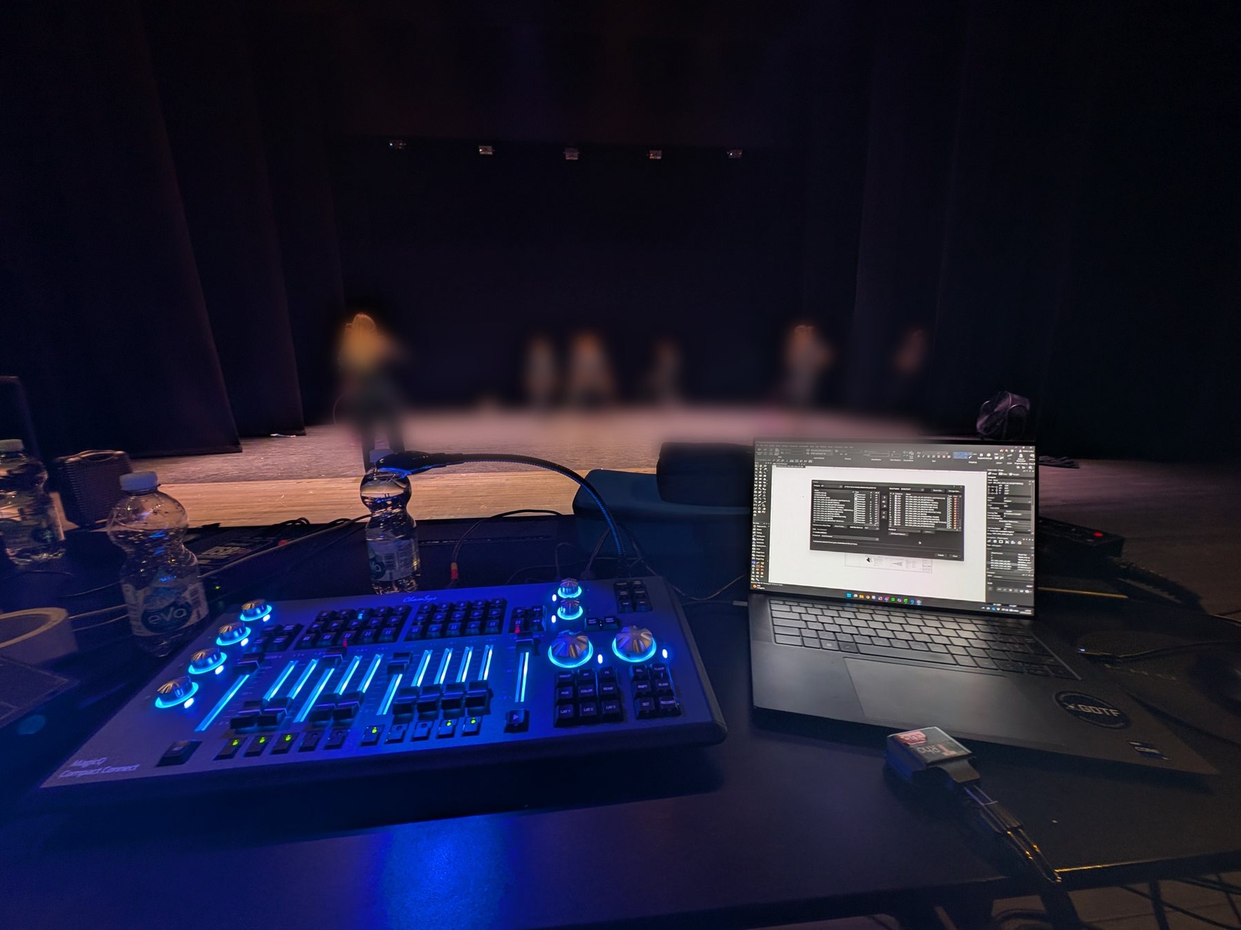 ChamSys MagicQ Compact Connect and a laptop running Vectorworks at the production desk during a rehearsal